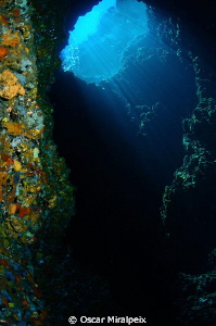 "El Dofí" cave, Medes Islands by Oscar Miralpeix 